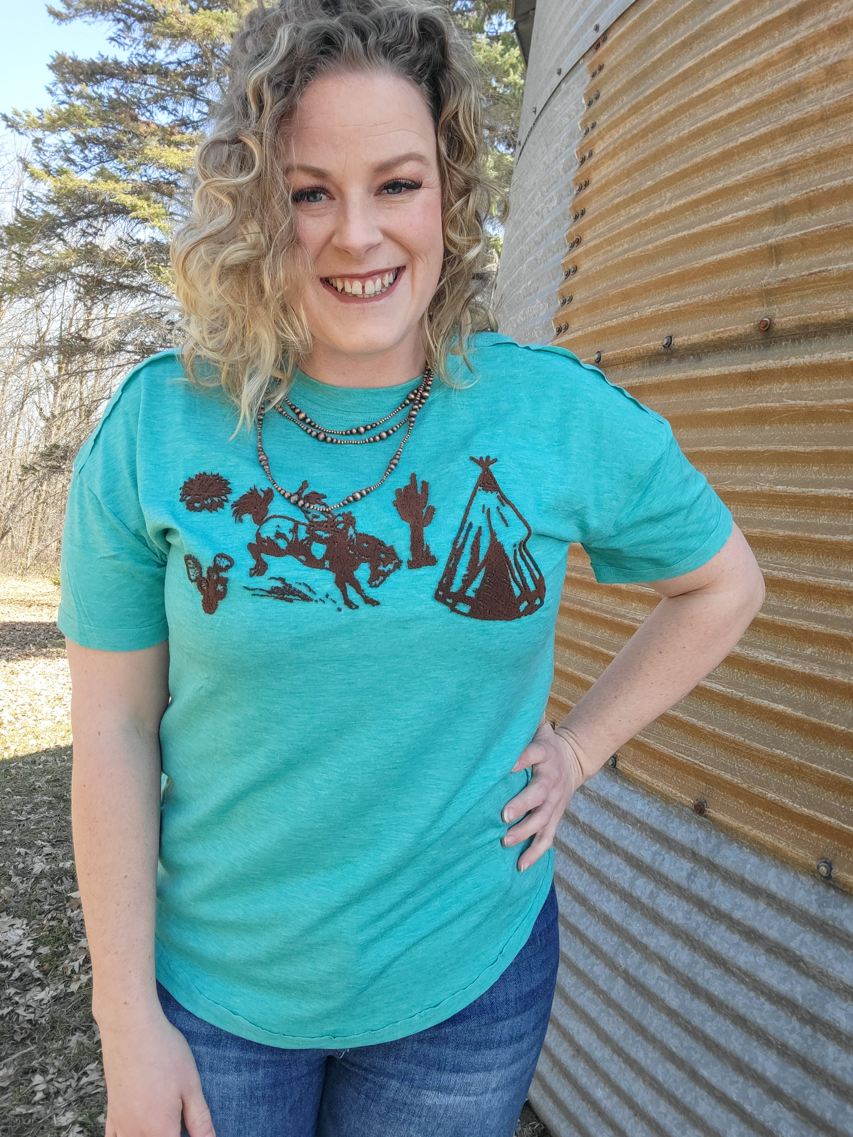 The Buckin Bronc Tee Gravel Road Mercantile The buckin bronc tee gravel road mercantile