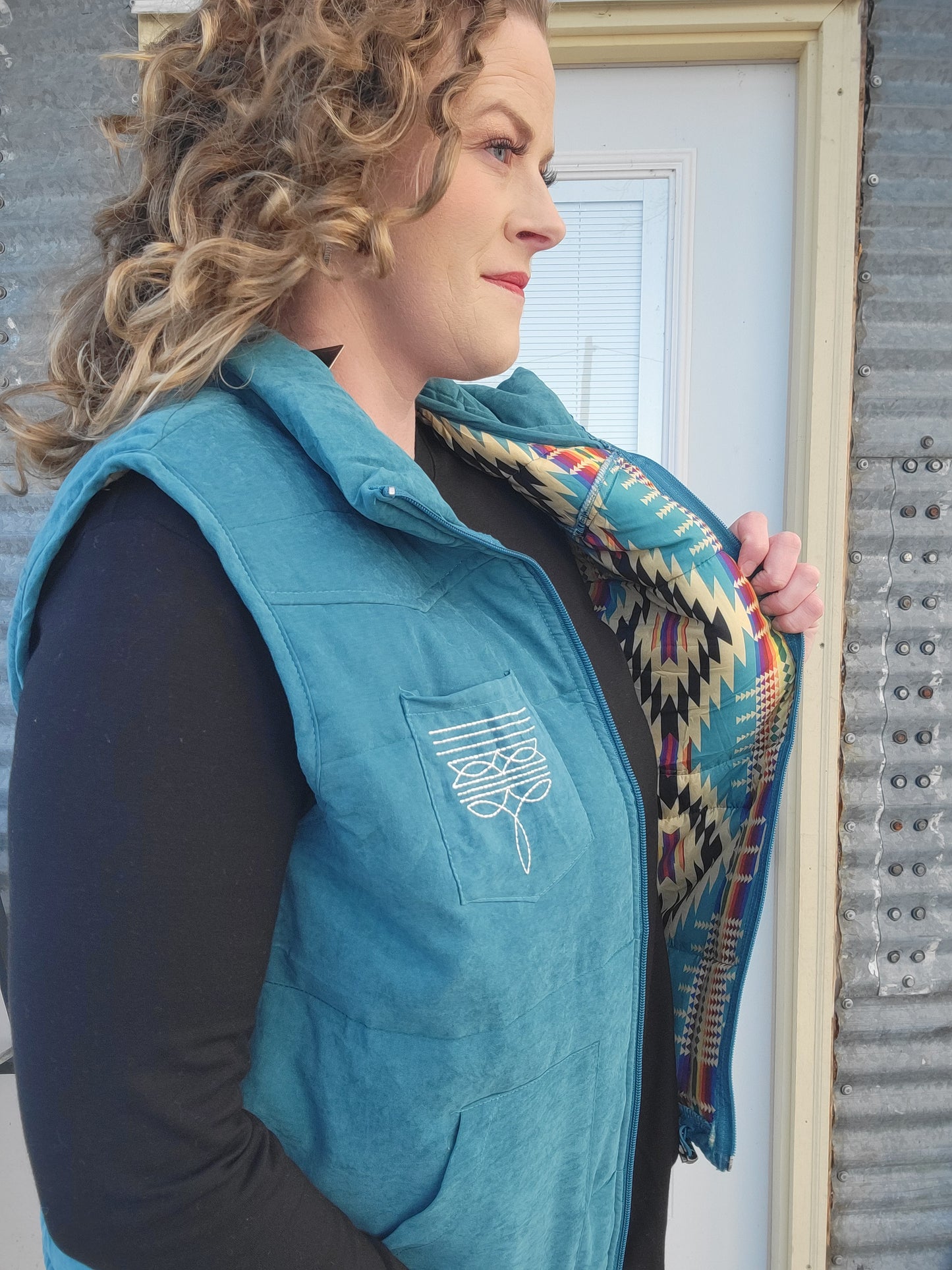 Blue Puffer Vest with Aztec Lining Boot Stitch Detail