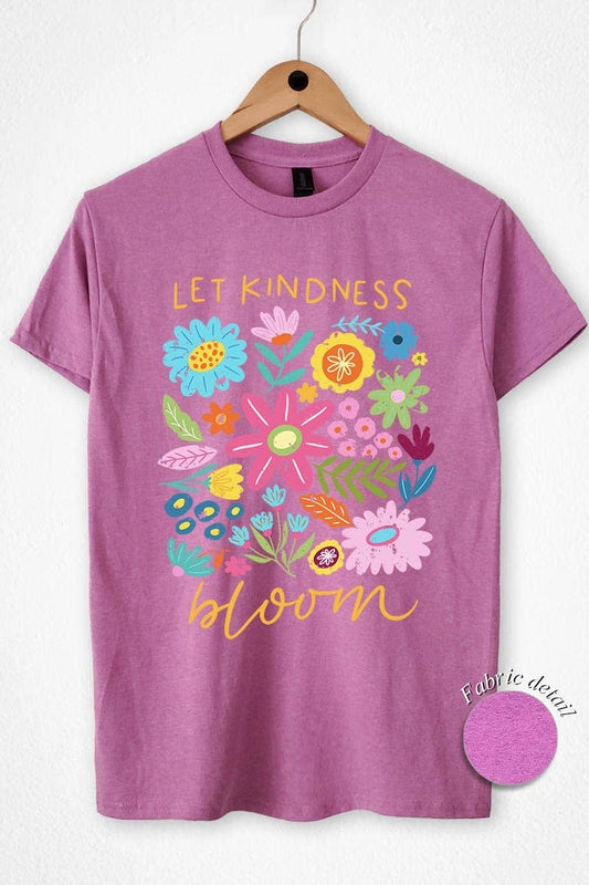 Purple t-shirt with floral design and 'Let Kindness Bloom' text on a hanger.